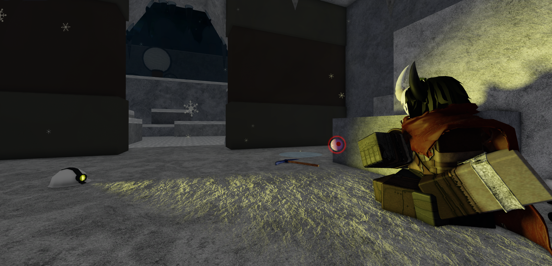 A man with horns is sitting inside of a cave while levitating some sort of sphere. It aappears to be snowing outside.